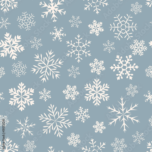 Seamless simple pattern of different blue geometric snowflakes