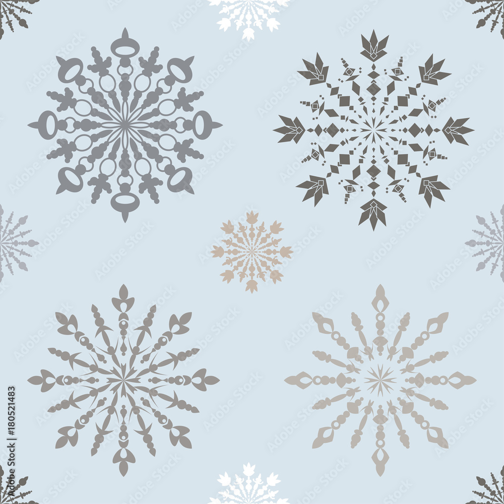 Fototapeta premium Seamless pattern with large and small blue patterned snowflakes on white background