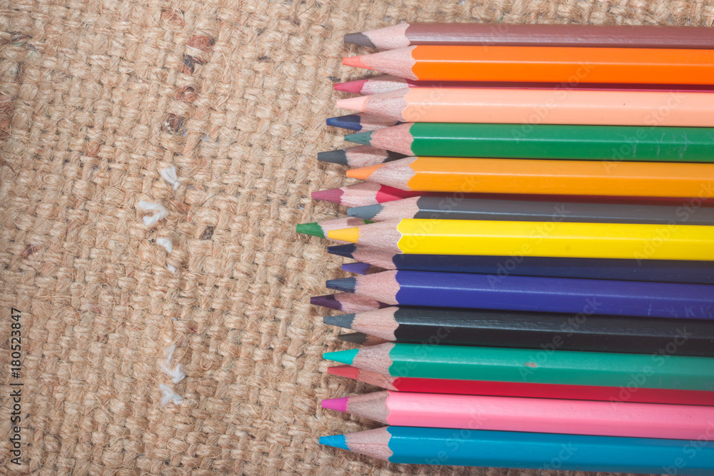 Fototapeta premium The color Crayon isolated on Sackcloth background 