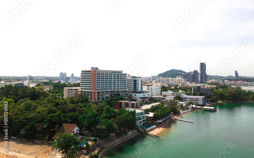 Aerial view of sea beach with city and island background
