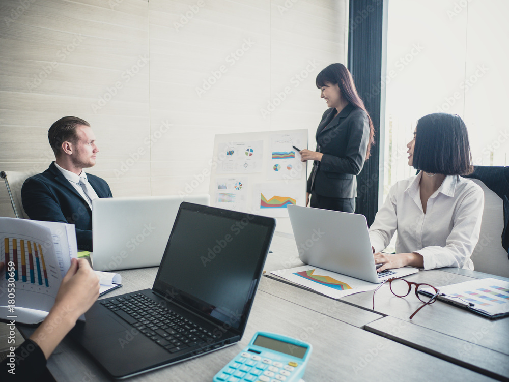 Asian Business Woman presenting her work with team at the meeting room, People working Concept. Vintage tone. Asian Business Woman presenting her work with team at the meeting room, People working Concept. Vintage tone.
