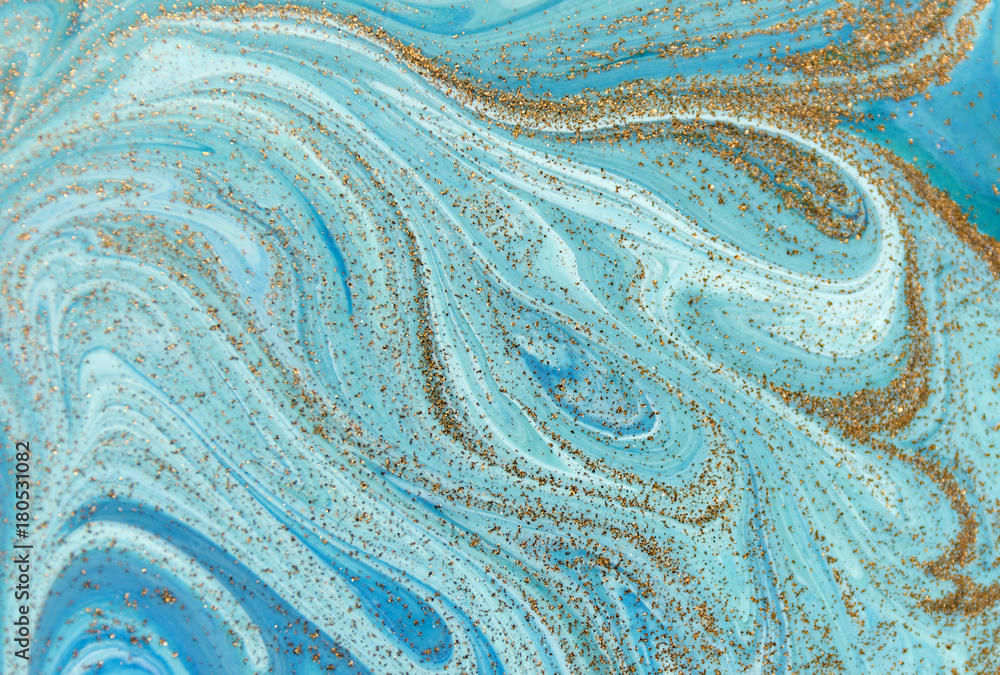 Marbled green and blue abstract background with golden sequins. Liquid marble ink pattern.