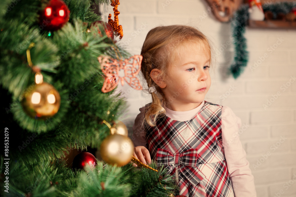 Pretty little child near Christmas tree. Pretty little child near Christmas tree.