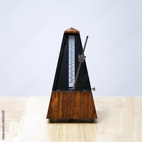 Obraz na plátně Metronome in action, closeup, isolated and on a plain background