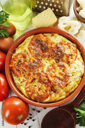 Cauliflower baked with tomato, cheese and eggs