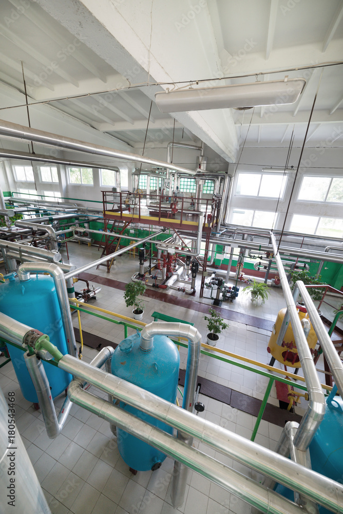 Modern boiler room. Complex system of tanks, pipelines, pumps and valves.