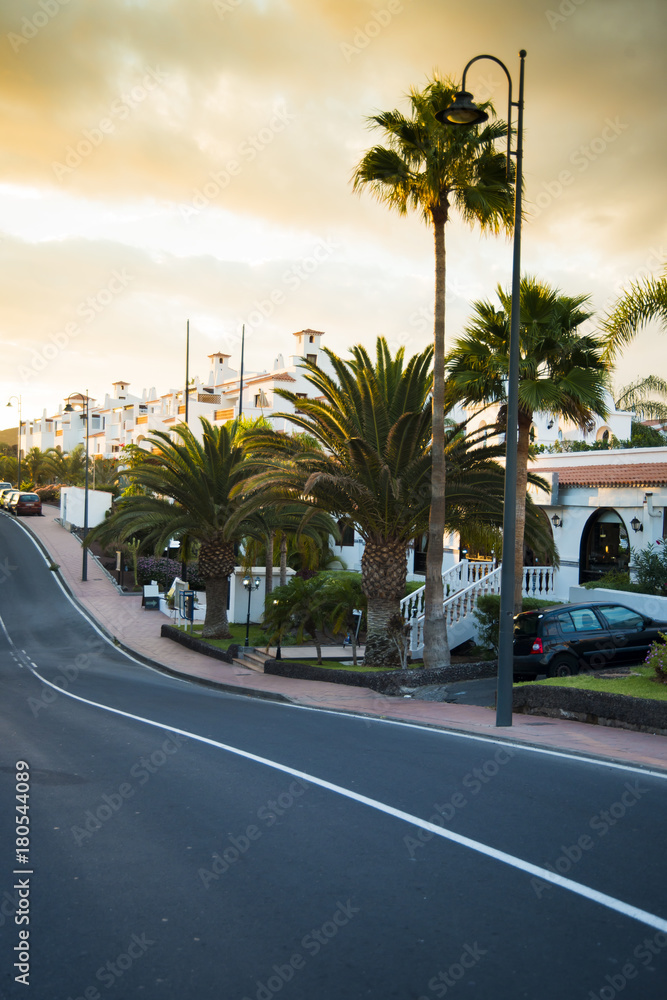 Street of the little tropical city in the sunset