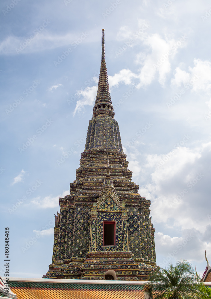 Fototapeta premium Pagoda is in Wat Pho that was named as the temple of the pagoda or chedi that are decorated with yellow glaze or glazed tiles or dark blue