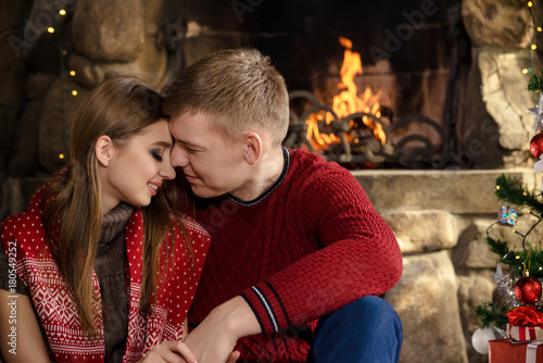happy young couple celebrates christmas together