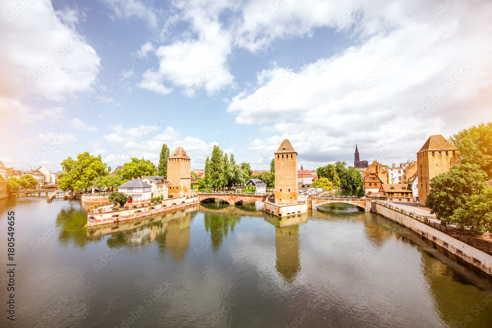 Landscape view on Petite-France region with beautiful ancient towers and bridge in Strasbourg city, France