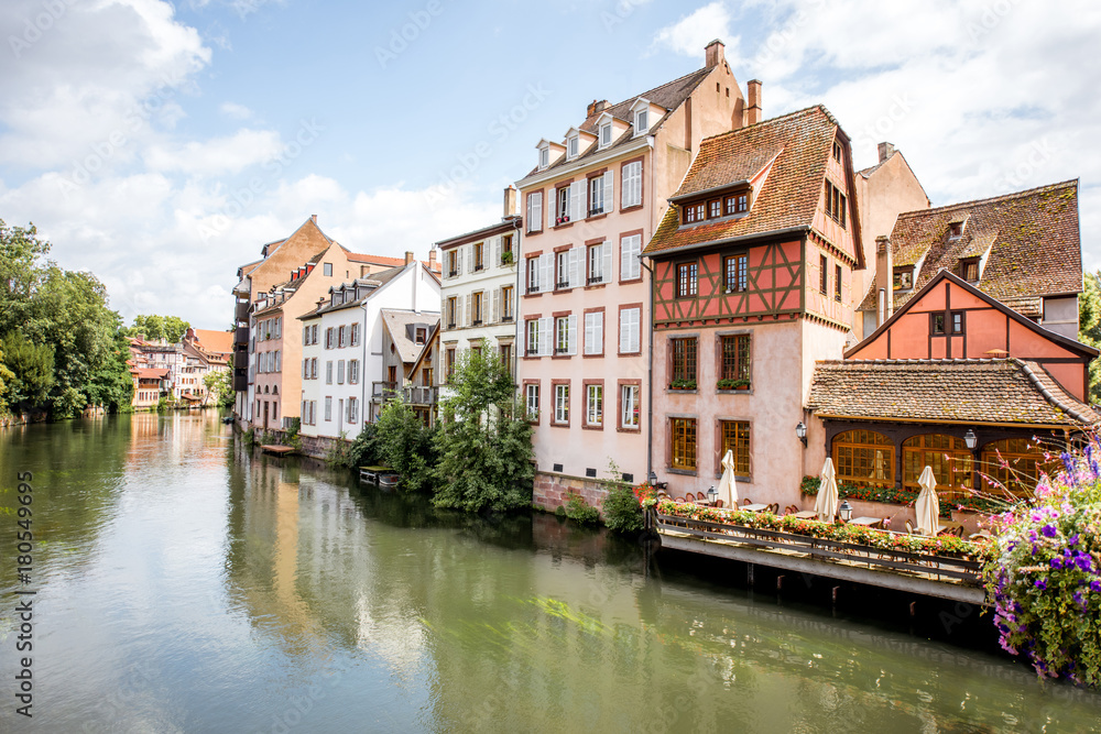 Landscape view on the water channel with beautiful half-timbered houses in Strasbourg city, France