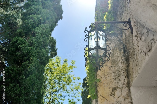 Positano, Amalfi coast, Italy - view of a lamp, plants and building facade