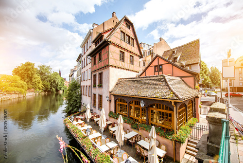 Fototapeta Naklejka Na Ścianę i Meble -  Landscape view on the water channel with beautiful half-timbered houses in Strasbourg city, France