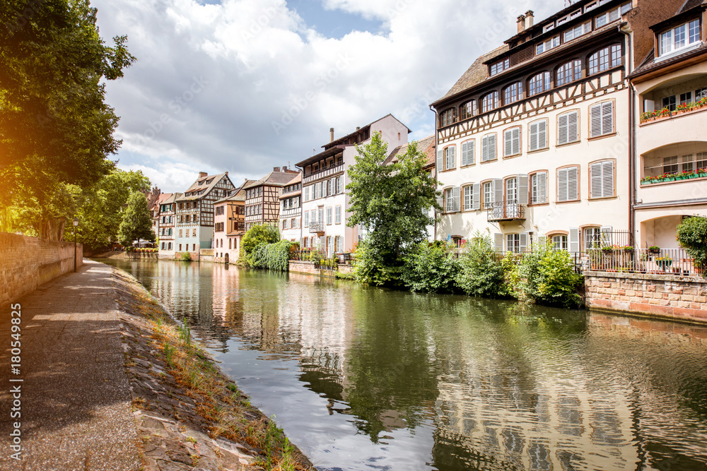 Landscape view on the water channel with beautiful half-timbered houses in Strasbourg city, France