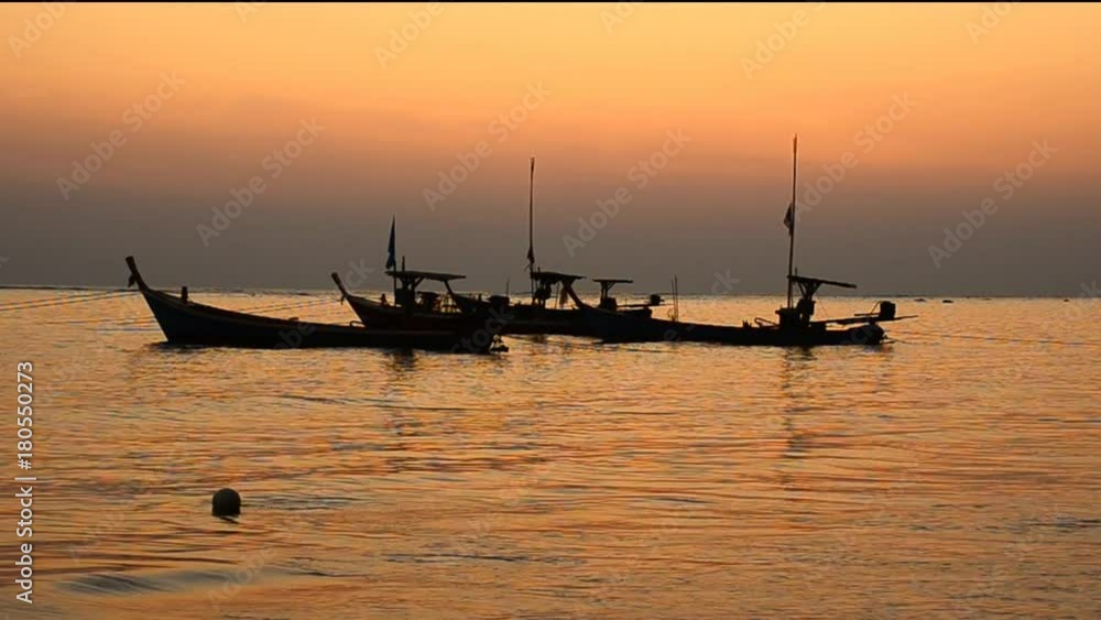 Beautiful sunset and boat at the beach Beautiful sunset and boat at the beach
