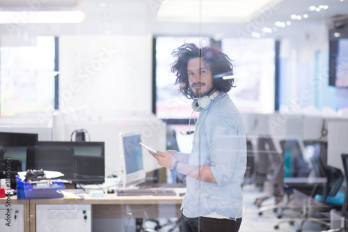 Wallpaper Mural businessman using tablet computer Torontodigital.ca