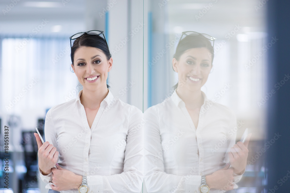 Business Woman Using Digital Tablet in front of startup Office Business Woman Using Digital Tablet in front of startup Office