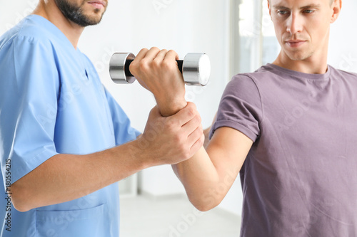 Physiotherapist working wit...