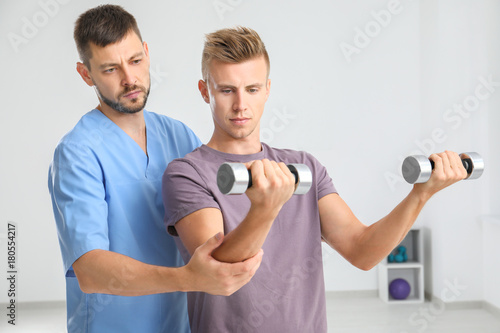 Physiotherapist working wit...