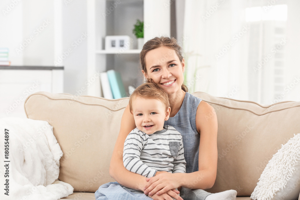 Mother with baby boy on sofa at home Mother with baby boy on sofa at home