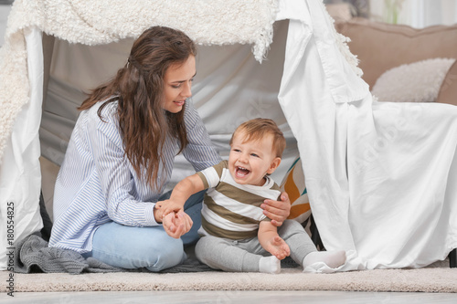 Mother with baby boy playin...