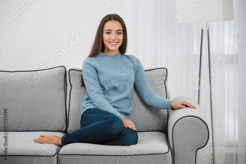 Young woman on sofa at home