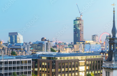 LONDON - JUNE 29, 2015: Aerial skyline of the city at night. The city attracts 30 million people every year