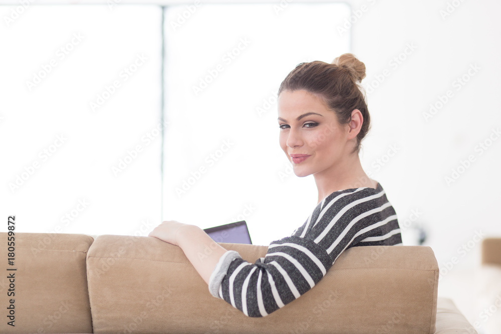 portrait of a young beautiful woman sitting on the sofa portrait of a young beautiful woman sitting on the sofa