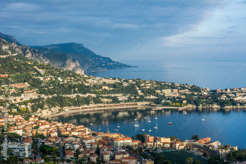 aerial panoramic top view of surrounding hills. view of coastline and beach with blue sky luxury resort and bay with yachts Nice port. Travel in French Riviera
