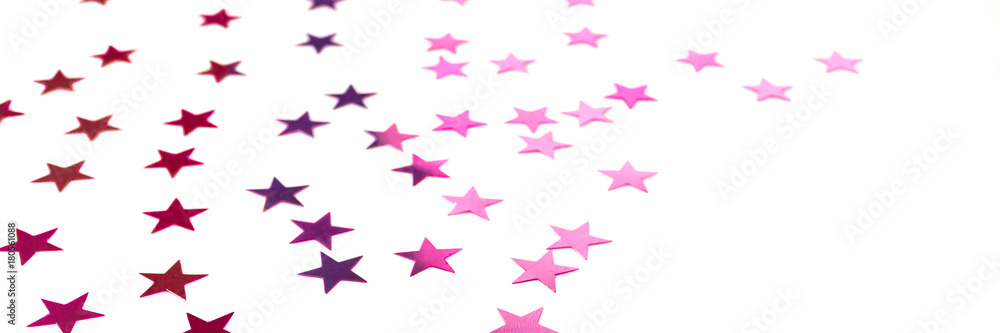 Colorful shiny stars on a white background, copy space Colorful shiny stars on a white background, copy space