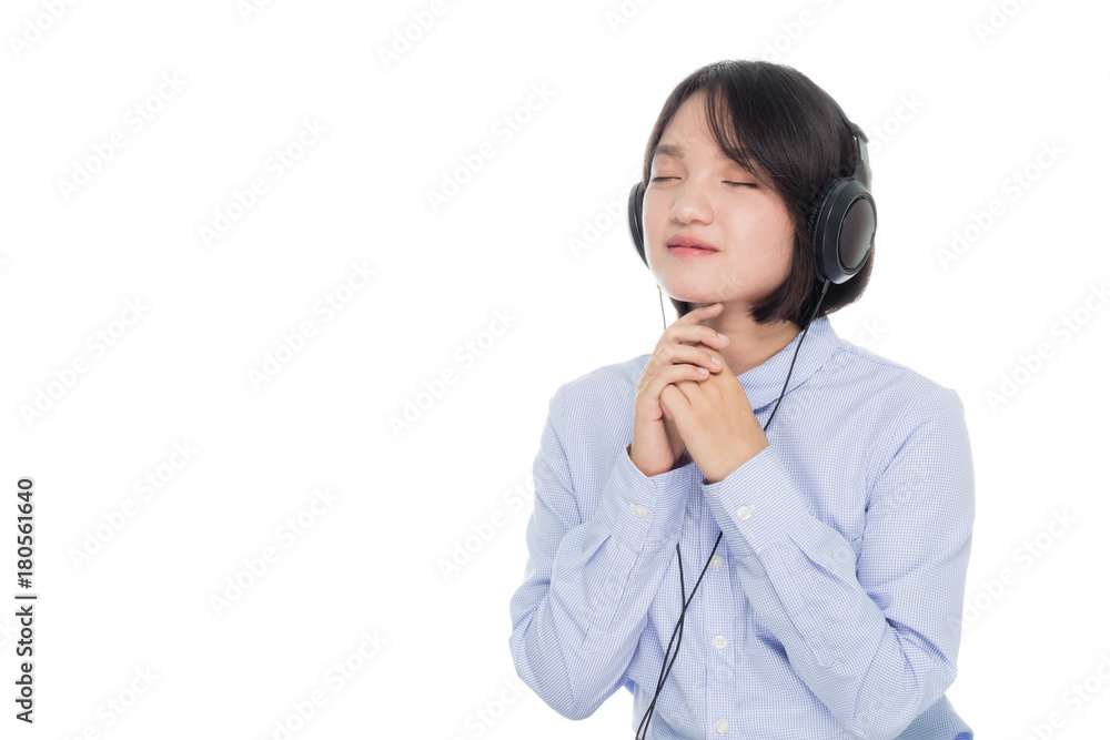 Portrait of a young business woman smiling with earbuds / headphone for listening to music or talking on smart phone. Isolated on white background