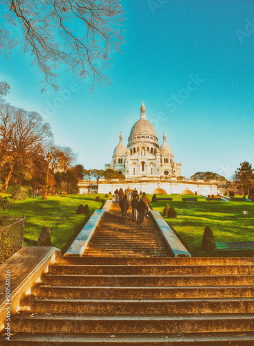 PARIS, FRANCE - DECEMBER 2012: Tourists visit Sacred Heart cathedral. The city attracts 40 million people every year © jovannig