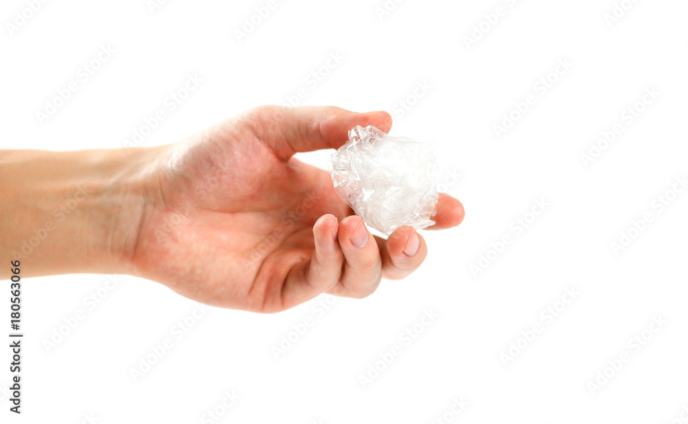 The hand holds a bundle of transparent tape. Isolated on white background The hand holds a bundle of transparent tape. Isolated on white background