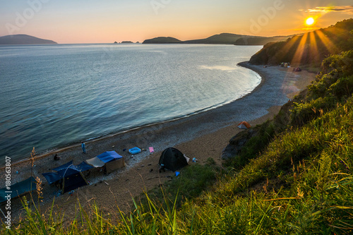 sunset camping view on the beach of russian isle Putyatin photo