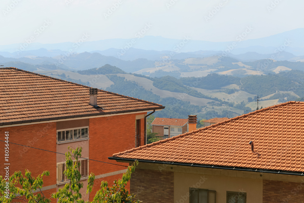 Urbino, Italy - August 9, 2017: the old city. roofs of houses under red tiles. view from above.