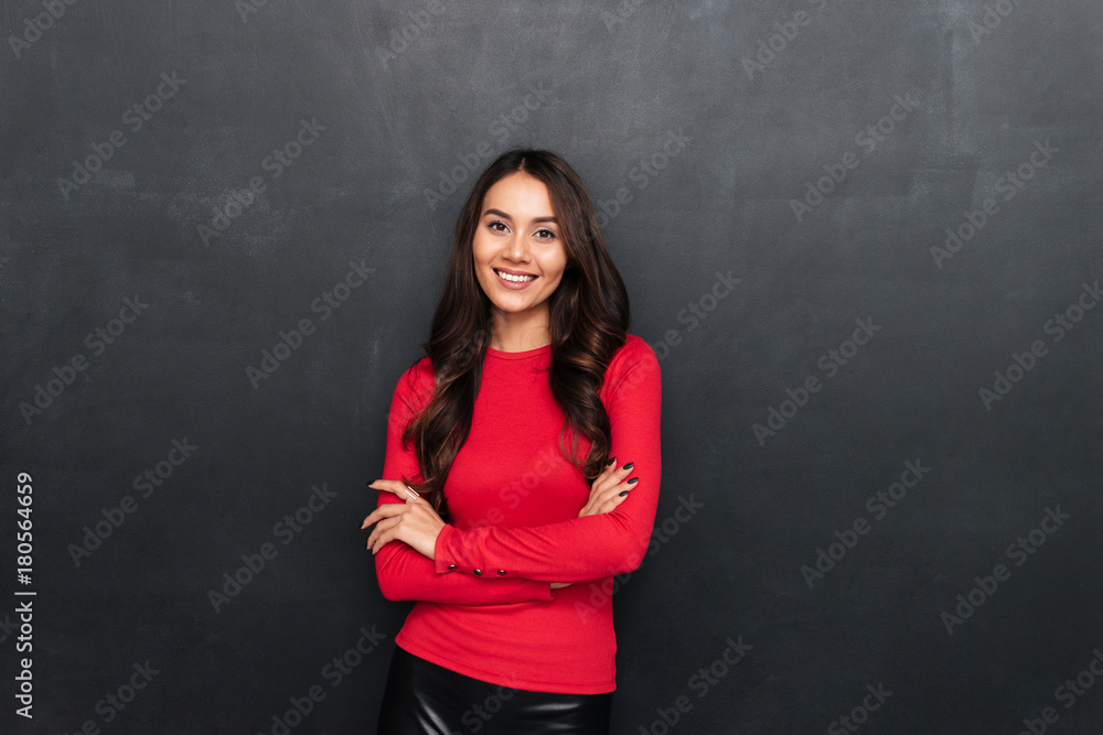 Cheerful young beautiful woman with arms crossed. Cheerful young beautiful woman with arms crossed.