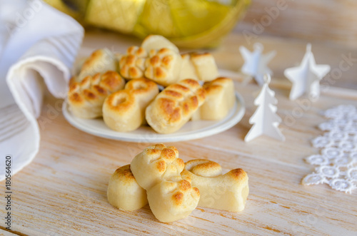  Spanish Christmas marzipan sweets with different christmas decoration. Figuritas on wooden table. Traditional treat consumed during winter holidays in Spain. photo