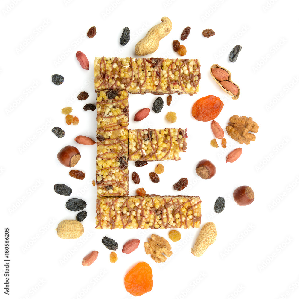Granola (muesli, cereal) bar in form of letter E and its ingredients Granola (muesli, cereal) bar in form of letter E and its ingredients