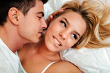 Couple in love lying on bed