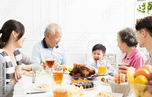 happy asian family having dinner  at home