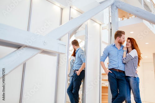 Beautiful couple in gorgeously designed apartment