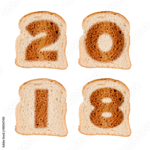 2018 greeting card on toasted slices of bread isolated on white background