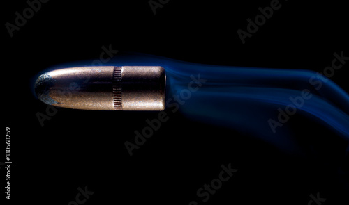 Bullet with blue smoke