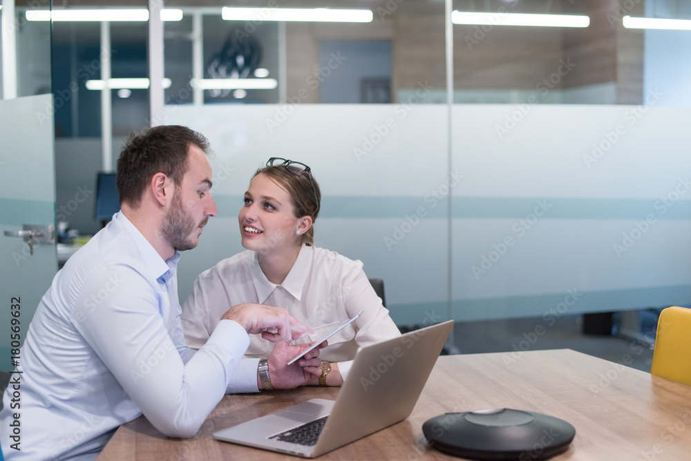 Business People Working With Tablet in startup office Business People Working With Tablet in startup office