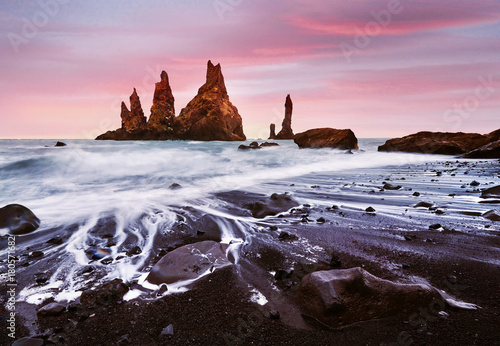 Iceland, Jokulsarlon lagoon, Beautiful cold landscape picture of icelandic glacier lagoon bay, The Rock Troll Toes. Reynisdrangar cliffs. photo