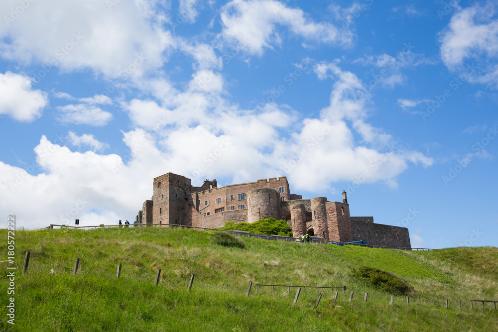 Bamburgh Castle Northumberland north east England UK with blue sky in summer