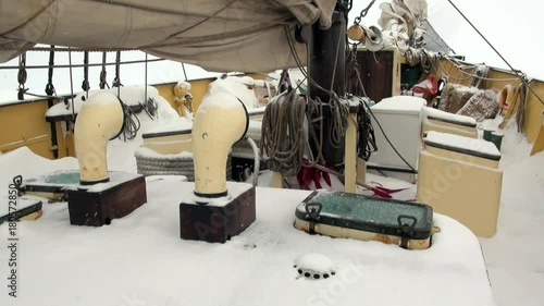 Deck of ship under snow in Arctic. Way from Longyear to Pyramiden Spitzbergen Svalbard. photo