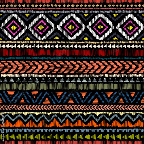 Embroidered ethnic seamless pattern. Aztec and tribal motifs. Striped ornament hand drawn. Print in the bohemian style. photo