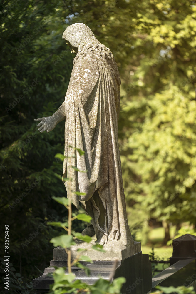 old Jesus sculpture in a park old Jesus sculpture in a park
