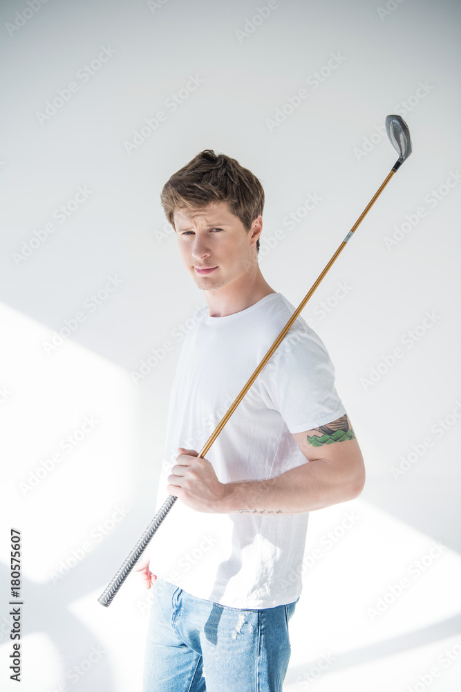 young man playing golf